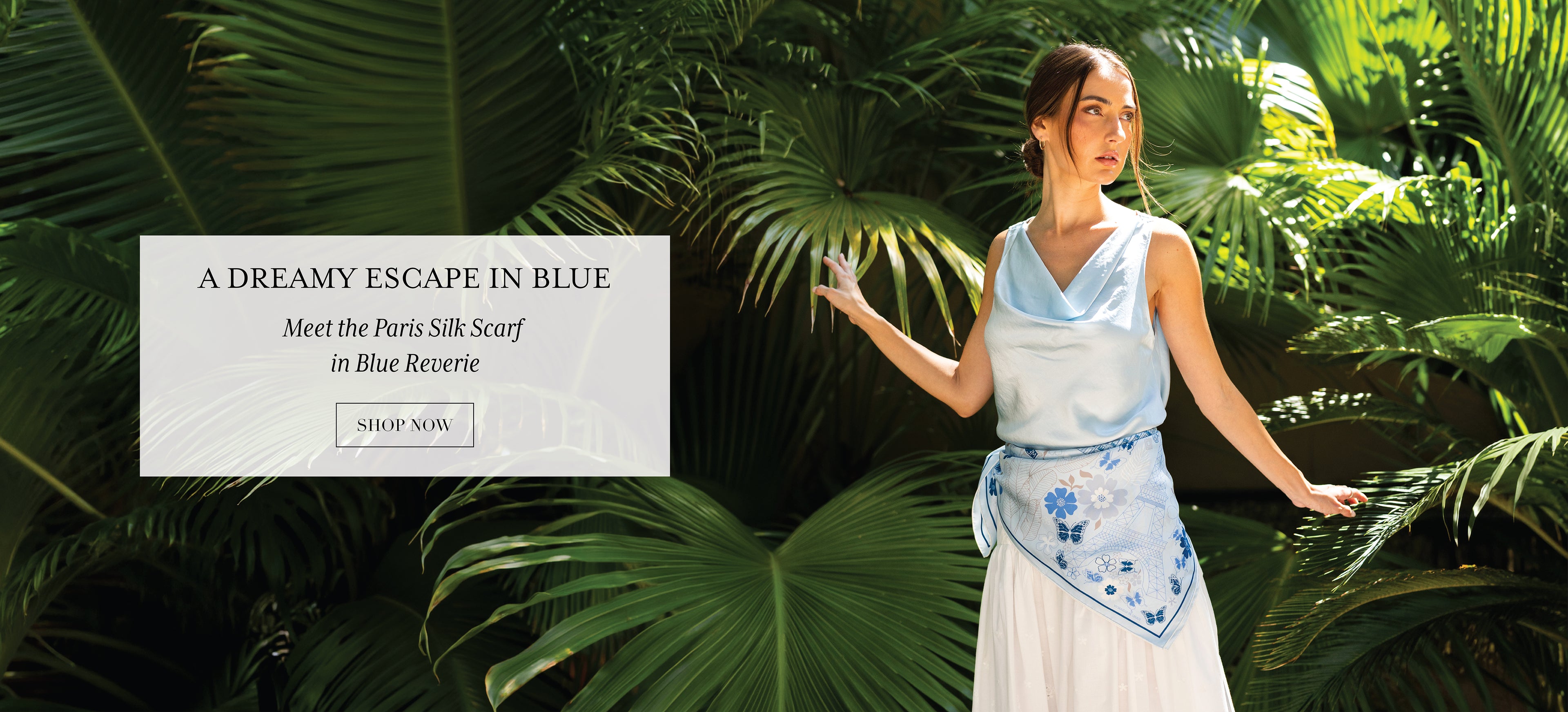 Blue Paris silk scarf featuring hand-drawn Eiffel Tower and Paris landmarks styled as a belt