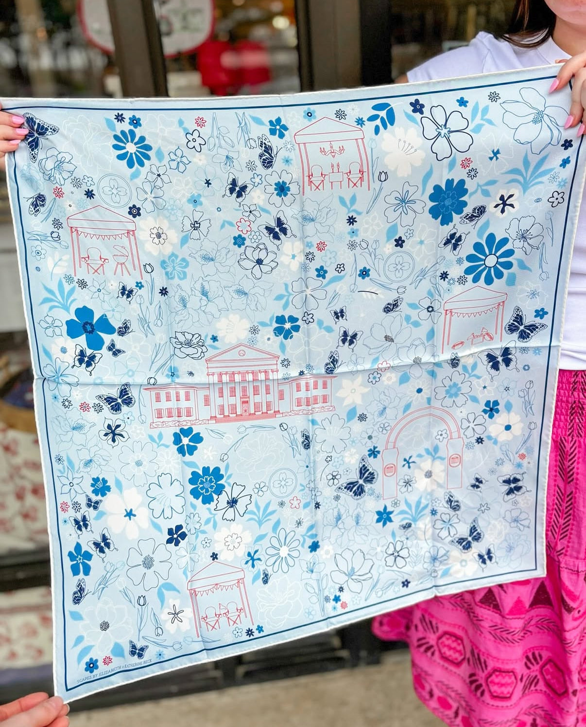 Custom hand-drawn silk scarf in blue, white, and red, designed for a local boutique.