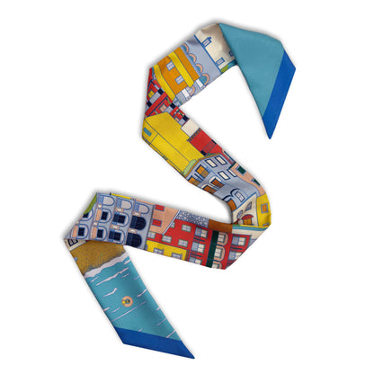 Citrus Splash Amalfi Coast silk skinny featuring hand-drawn illustrations of Positano and Italy's Amalfi Coast in vibrant blue, red, yellow, and green tones displayed in a lay-flat view.