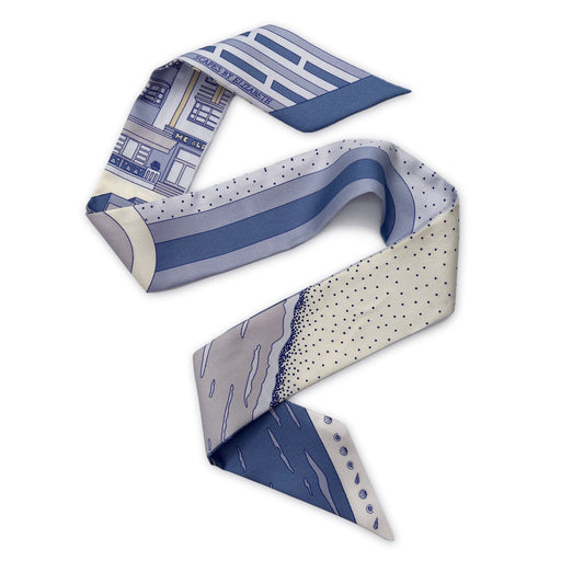 Cool Blue Miami Beach silk twilly featuring hand-drawn Miami Beach Art Deco architecture, coastal scenery, and geometric design details displayed in a folded lay-flat view.