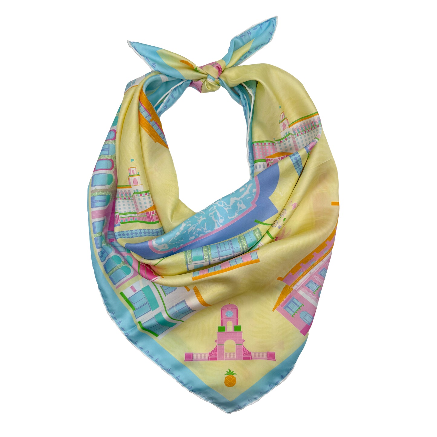 Pink Breeze Palm Beach silk scarf styled as a neck bandana featuring hand-drawn Palm Beach landmarks, architecture, and coastal-inspired artwork in bright yellow, pink, and blue tones.